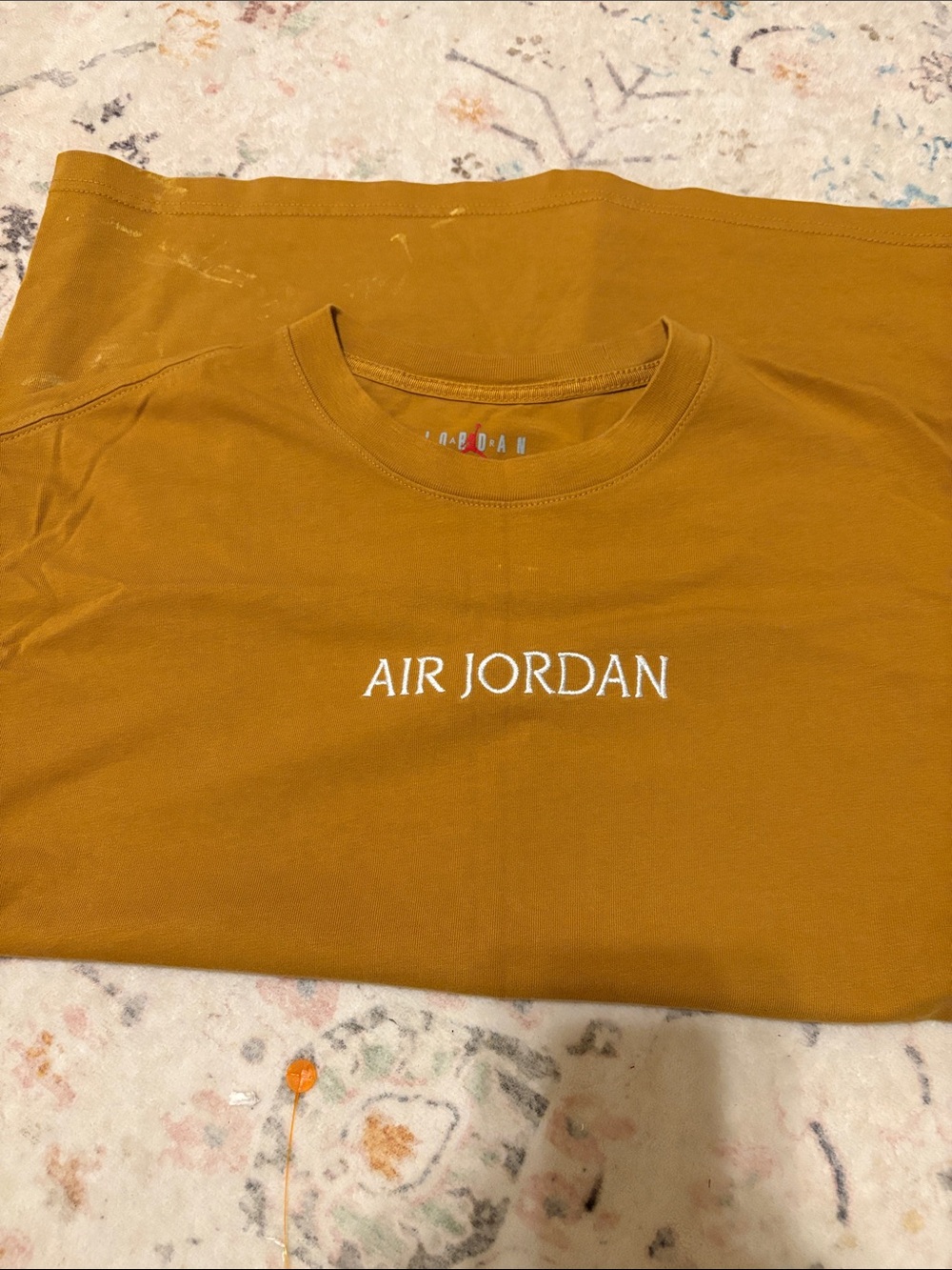 Jordan Short Sleeve Tee in Mustard with White Air Jordan Logo. Couple spots! L